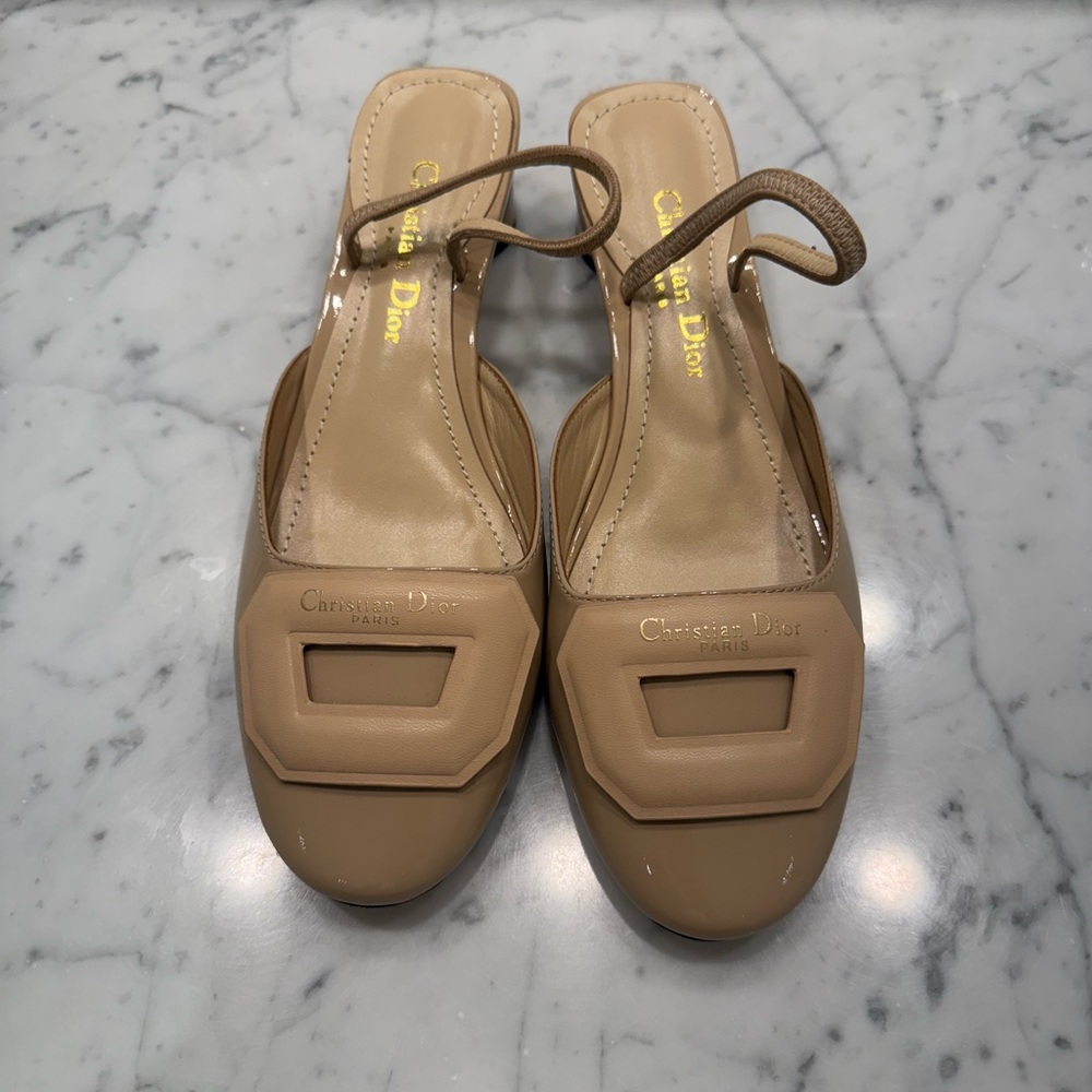 Cream patent leather slingback pumps